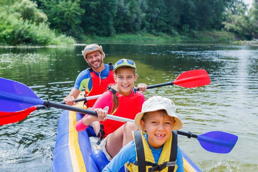 Family kayaking on the river