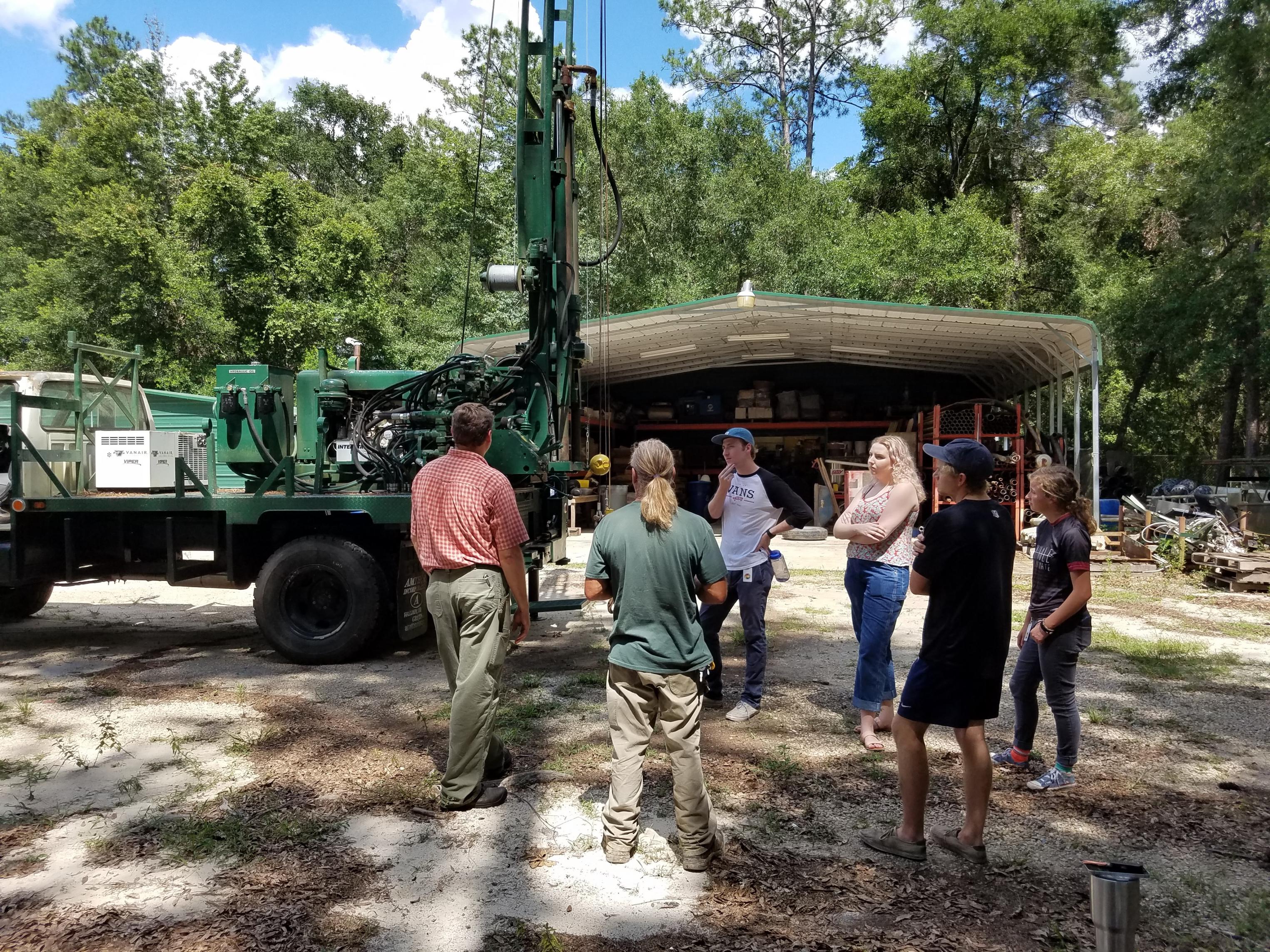 A group of DEP interns at a drilling site in July 2017