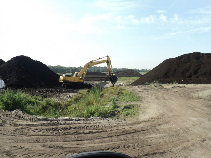 An excavator peat mining at Hurley Mine