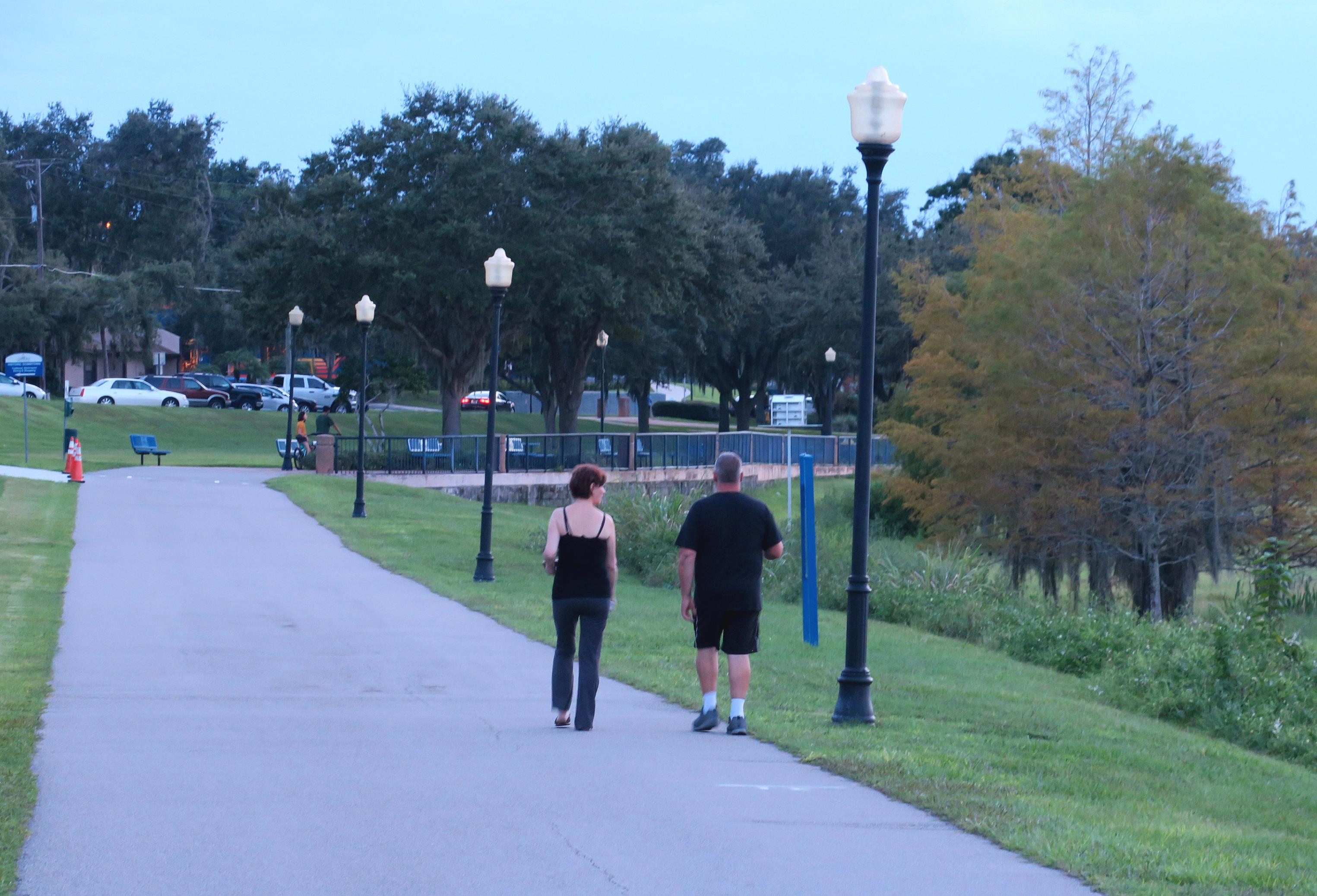 Walkers on Clermont's South Lake Trail, by Doug Alderson, OGT